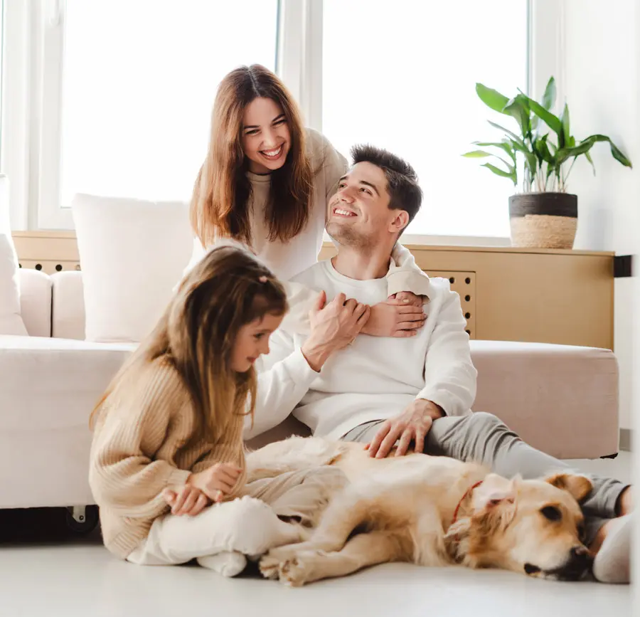 family-at-home-with-dog-GettyImages-1940780626